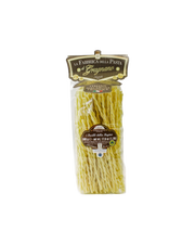 Zia Pia - Fusilli Della Regina by La Fabbrica della Pasta: Clear package of long, twisted fusilli, crafted in Gragnano, Italy, emphasizing artisanal pasta tradition.