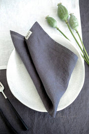 MagicLinen - Set of 2 linen napkins on a plate, showcasing premium quality and timeless appeal for versatile table decor. Ideal for enhancing dining experiences.