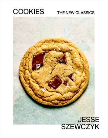 Cookbook cover featuring a chocolate-chunk cookie with the title Cookies: The New Classics by Jesse Szewczyk, highlighting innovative cookie recipes.