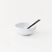 Sarah Kersten - Ramen Bowl: Dove Grey, featuring chopsticks resting inside. Ideal for ramen, salads, or rice bowls, designed to fit seamlessly into your kitchen collection.