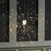 Napa Home & Garden - Napa Night Sky LED Starburst Lights Large hanging from a ceiling, showcasing intricate 50 copper strands and 200 warm white LED lights.