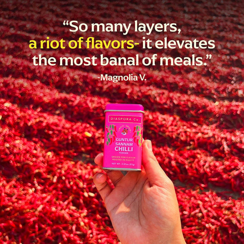 Hand holding Diaspora Co. Spices - Guntur Sannam Chilli can, showcasing sustainable, zero-budget natural farming produce from Guntur, Andhra Pradesh.