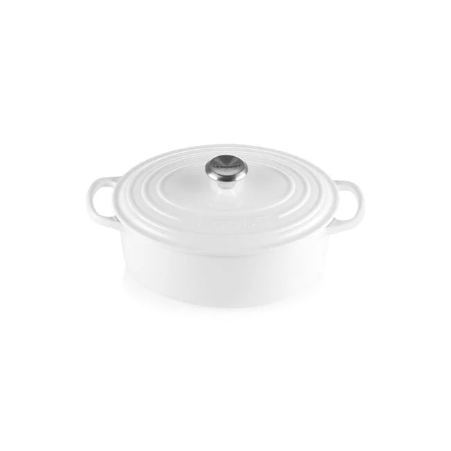Le Creuset Signature Oval Dutch Oven, 8 QT, White, featuring a lid and side handles, ideal for braising and stews, showcased by Athens Cooks.