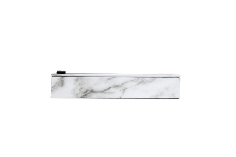 ChicWrap | Aluminum Parchment & Plastic Refills - Foil Refill displayed on a marbled surface, featuring a white rectangular form with a black handle for easy dispensing.