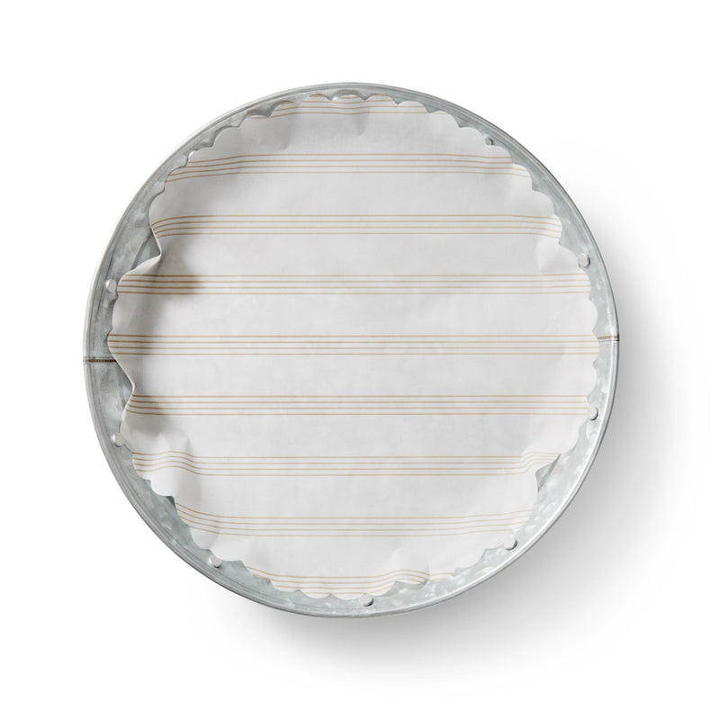 Sandy Stripes Original Flat Plate Liners displayed on a metal tray, highlighting the oval design, ideal for enhancing dining presentation.