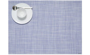 Chilewich Mini Basketweave Rectangle Placemat in use, featuring a plate with a white bowl and spoon, showcasing its elegant texture for dining settings.