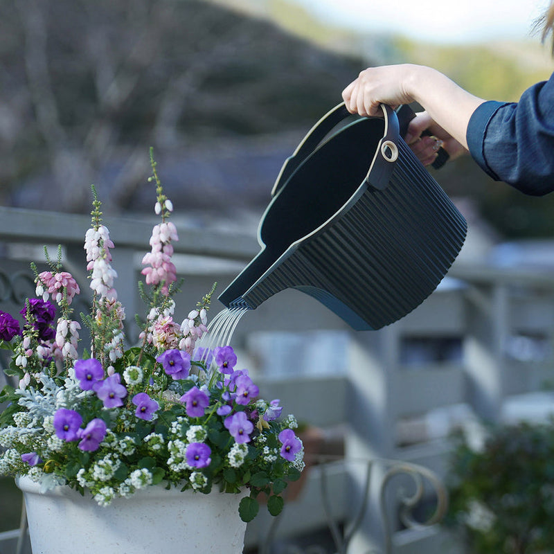 Hachiman Garden Beetle watering cans in garden setting