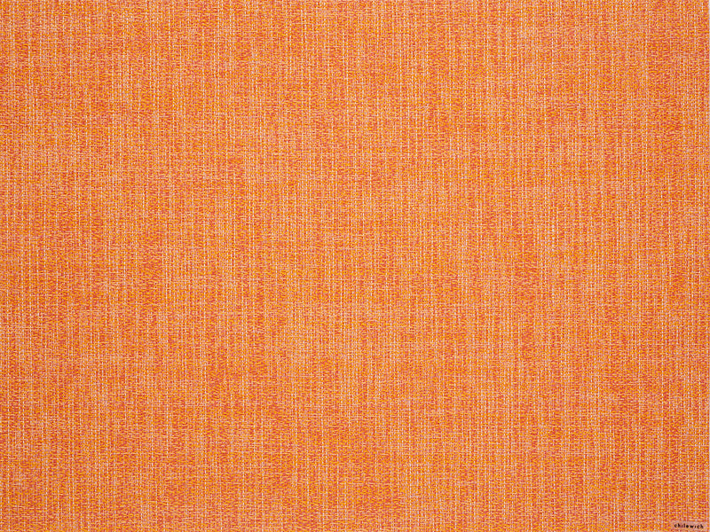 Chilewich | Boucle Rectangle Placemats - Tangerine, showcasing a close-up of the textured crepe weave fabric, ideal for both indoor and outdoor dining settings.