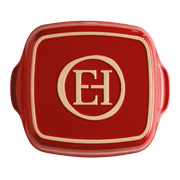 Emile Henry | Square Bakers, Burgundy: Red ceramic baking dish with side handles, embossed with EH monogram, ideal for versatile oven-to-table use, crafted from heat-retaining Burgundian clay.