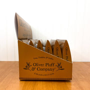 Oliver Pluff & Company - Orange Clove Hot Toddy Kit displayed in a gold box with triangular sachets, offering a winter warmer blend for Athens Cooks customers.