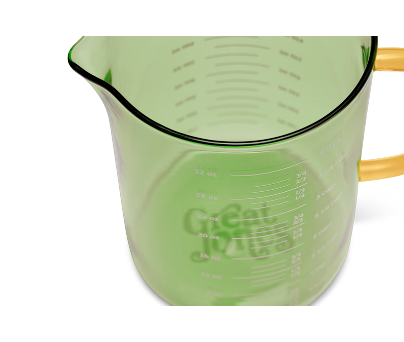 Great Jones | Beyond Measure 4-Cup - Broccoli-Butternut glass measuring cup with clear measurements, precision-pour spout, ideal for kitchen prep and serving.