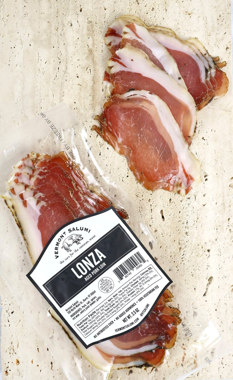 Vermont Salumi | Sliced Lonza: A vacuum-sealed pack of aged pork loin charcuterie, with thinly sliced pieces showcasing its lean, smooth texture and herbaceous flavor.