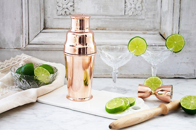 Coppermill Kitchen's Vintage Inspired Jigger and Shaker set features an Art Deco design with engine-turned patterns, perfect for sophisticated home bars.