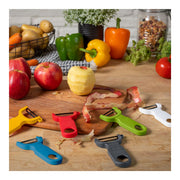 Kuhn Rikon | Original Swiss Peeler - Grey on cutting board with apples, surrounded by colorful peelers, showcasing its ergonomic design for efficient fruit and vegetable prepping.