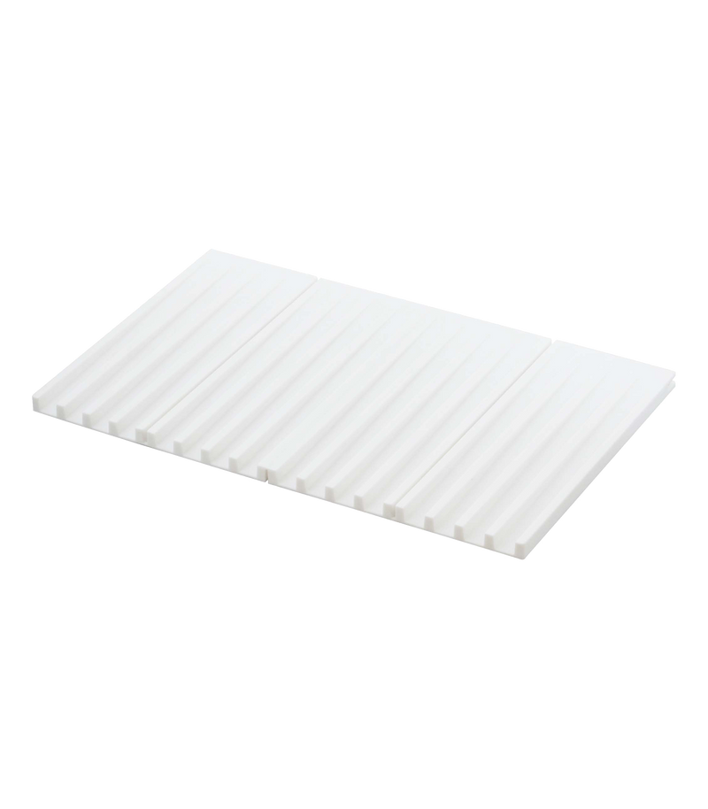 Yamazaki Home - Tower Folding Dish Drainer Mat in white silicone, featuring parallel grooves for efficient drying and foldable design for easy storage.