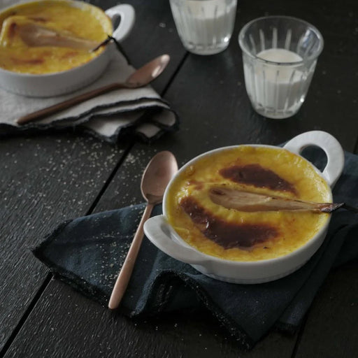 Pillivuyt | Toulouse Creme Brulee Dish, Set of 4, showcasing brûléed custard in elegant pleated ramekins, perfect for creating French-inspired desserts at Athens Cooks.