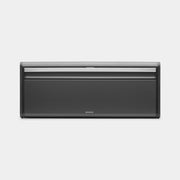 Brabantia USA Inc | Fall Front Bread Box, a space-saving rectangular bread box with a flat top for storage, ideal for keeping bread fresh in compact kitchen spaces.