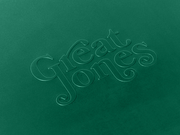 Great Jones | Little Sheet - Pepper, a quarter-sized nonstick sheet pan, ideal for small bakes or reheating, displayed with elegant calligraphy details.