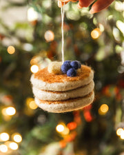 Farmhouse Pottery - Felted Breakfast Ornament: Waffle Stack, handcrafted in Nepal, featuring layered felt pancakes topped with blueberries and a butter pat.