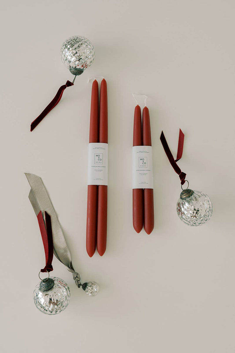 Mo&Co Home - Berry Red | Dipped Beeswax Taper Candles, 14 Inch, elegantly paired with silver baubles, perfect for sophisticated table settings or gifting.