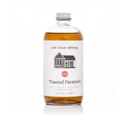 Pink House Alchemy - Toasted Caramel Syrup: A 16 oz glass bottle of handcrafted, small-batch syrup with warm nutty notes, perfect for enhancing culinary creations.