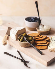 Farmhouse Pottery - Silo Ramekin: Single displayed on a cheeseboard with cheeses, crackers, cornichons, cocktail onions, and blueberries, exemplifying versatility and elegant kitchen presentation.