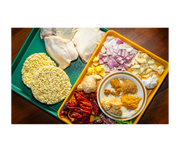 Great Jones | Little Sheet - Pepper, a quarter-sized nonstick sheet pan, ideal for baking small batches or reheating, showcased on a table at Athens Cooks.