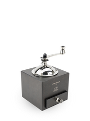 Peugeot | Roellinger Pepper Mill, Chocolate: A hand-crank grinder with a wooden body and stainless steel top, featuring a pull-out drawer for collecting grounds.