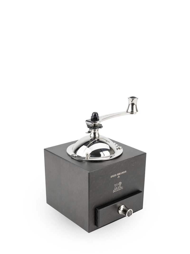 Peugeot | Roellinger Pepper Mill, Chocolate: A hand-crank grinder with a wooden body and stainless steel top, featuring a pull-out drawer for collecting grounds.
