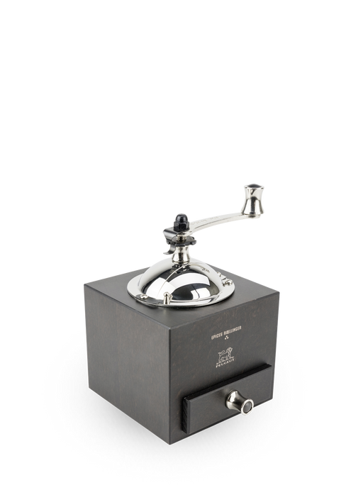 Peugeot | Roellinger Pepper Mill, Chocolate: A hand-crank grinder with a wooden body and stainless steel top, featuring a pull-out drawer for collecting grounds.