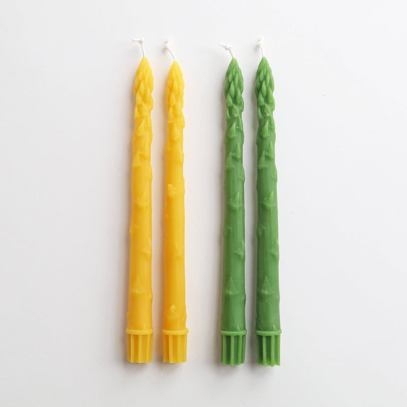 Artifaqt - Asparagus Beeswax Taper Candles (Pair): Green, molded from real asparagus spears, displayed on a white background, emphasizing their unique design and craftsmanship.