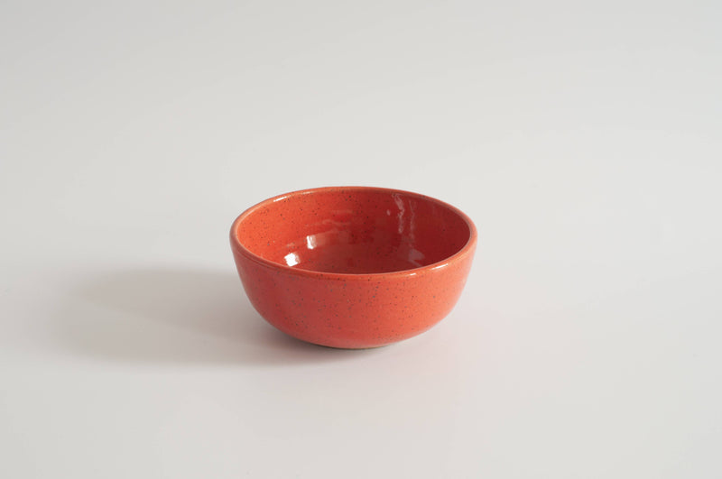 RachaelPots - Breakfast Bowl: Sage, a glossy, speckled reddish-orange ceramic bowl, perfect for breakfast or kitchen prep, hand-thrown from domestically sourced stoneware.