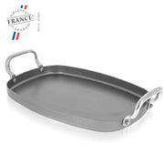 de Buyer Mineral B Element Rectangular Pan with two handles, 15x10.25 inches, cast iron skillet design, ideal for versatile cooking in the kitchen.