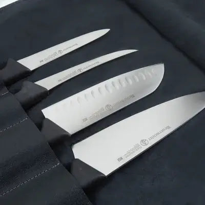 Messermeister - Vintage Leather 7 Pocket Knife Roll - Black: Stainless-steel knives in a black leather roll, featuring various blade types for versatile kitchen use.
