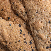 Potters Table - Cured Olive & Cracked Pepper Flatbreads, showcasing a golden-brown surface with salt crystals and pepper flecks, ideal for gourmet entertaining.