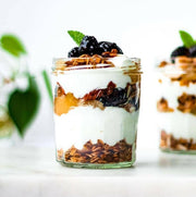 Le Parfait | Faceted French Jam Jar, 385ml, filled with layered yogurt parfait, crunchy granola, fruit compote, fresh blackberries, and a mint leaf garnish.