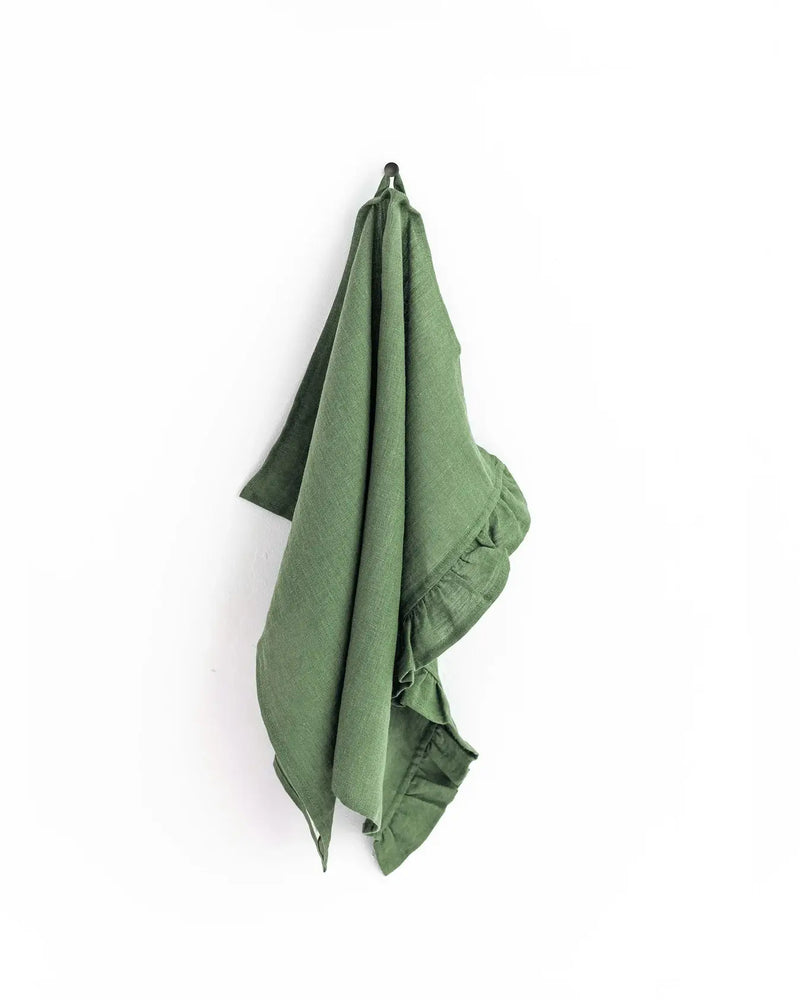 MagicLinen - Ruffle trim tea towel on hook, showcasing soft, absorbent linen perfect for kitchen use, with hanging loop for convenience.