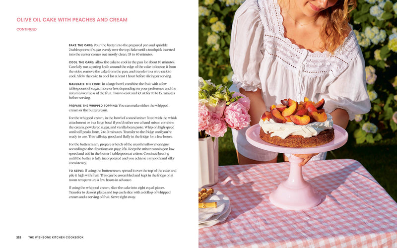 Wishbone Kitchen Cookbook spread featuring an Olive Oil Cake recipe with a summery photo of cake on a pink stand, embodying elegant, unfussy cooking.