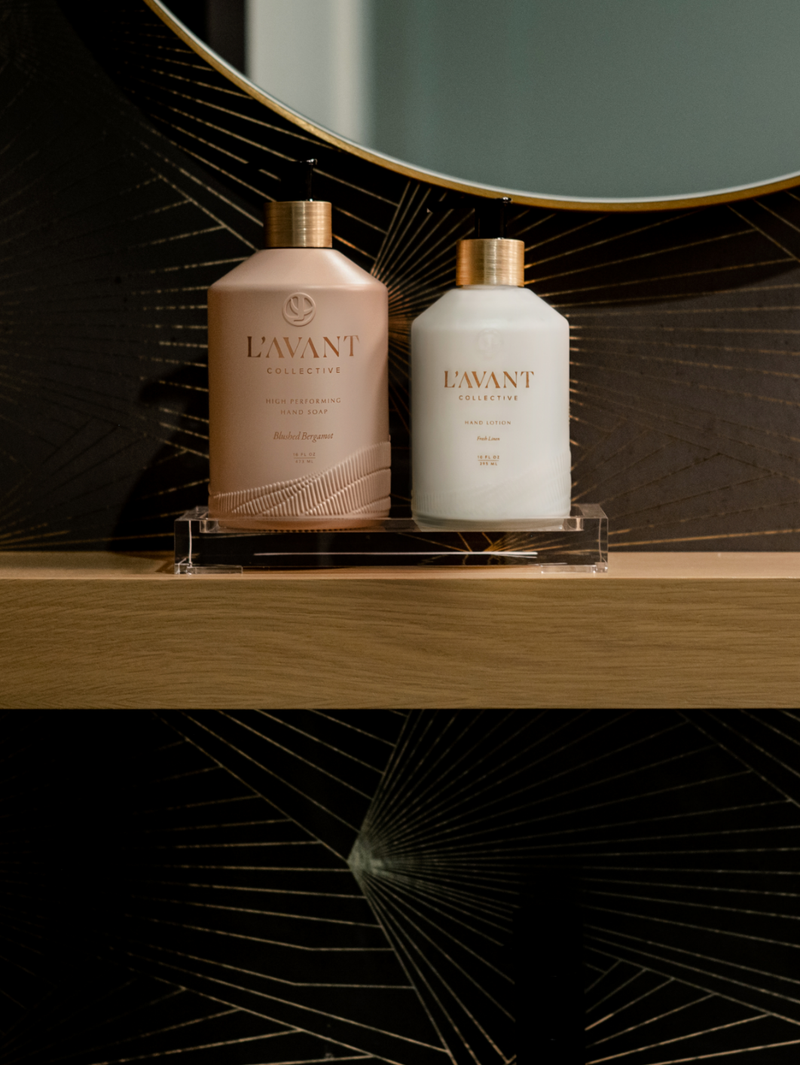 L'AVANT Collective High Performing Hand Soap - Blushed Bergamot bottles on a shelf, highlighting elegant design and luxurious scent for a premium handwashing experience.