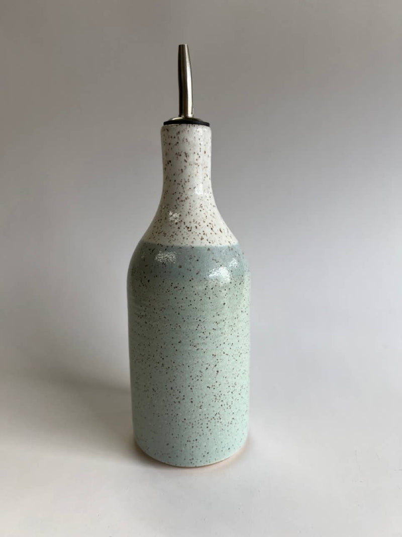 RachaelPots - Oil Cruet Large: Nude/White, features a handmade ceramic bottle with a metal pour spout, ideal for controlled olive oil dispensing.