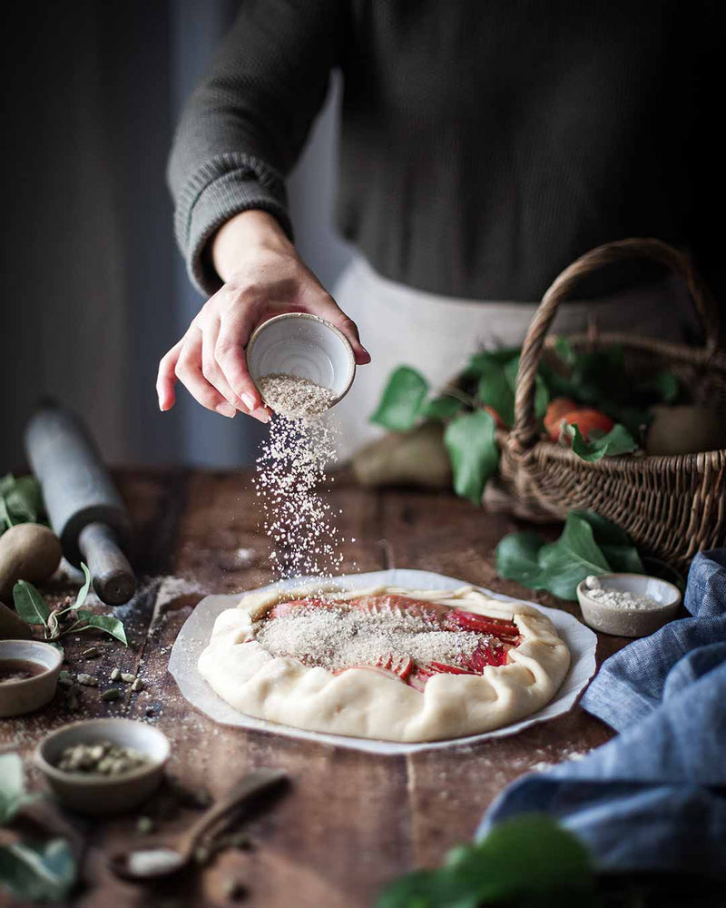 Farmhouse Pottery - Silo Ramekin: Single used for sprinkling ingredients on a rustic fruit galette, surrounded by baking tools and ingredients on a wooden board.