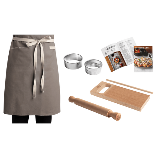 Marcato | Gnocchi Like A Pro Kit includes apron, cutters, rolling pin, cutting board, measuring stick, and recipe booklet, perfect for homemade gnocchi preparation.