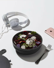 W&P | Make & Take Lunch Bowl - Ceramic - Charcoal, features a durable ceramic base, snap-tight silicone strap, and rigid lid, ideal for stylish, spill-free meal transport.