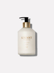 L'AVANT Collective - Fresh Linen Hand Lotion in a white bottle with a black pump, featuring gold text.