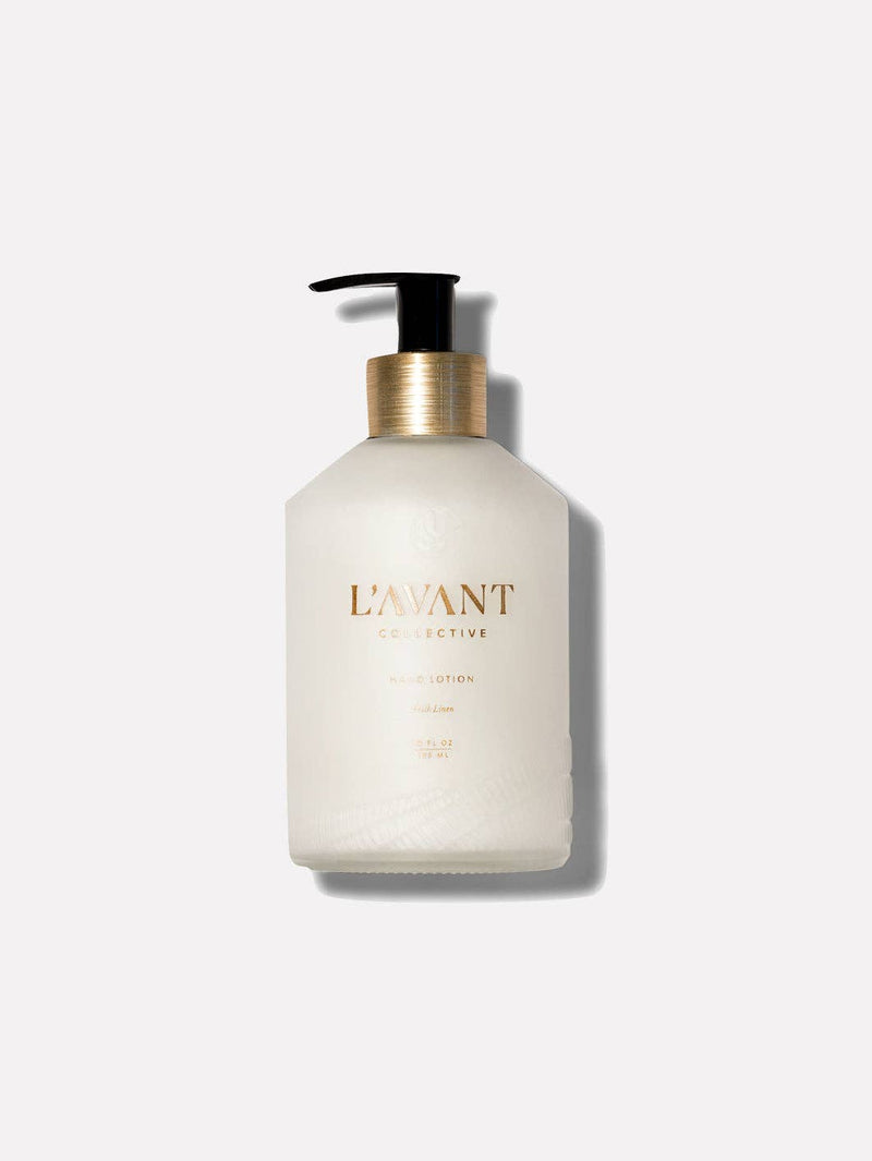 L'AVANT Collective - Fresh Linen Hand Lotion in a white bottle with a black pump, featuring gold text.
