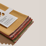 ATELIER SAUCIER - The Santa Fe Linen Napkins, a 4-piece set made from premium reclaimed fabric, showcasing vibrant desert-inspired colors. Ideal for enhancing any kitchen setting.