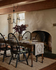 Wheat Harvest Dinner Napkin on a rustic table with candles, wine glasses, and a floral centerpiece, embodying fall abundance in a cozy dining setting.