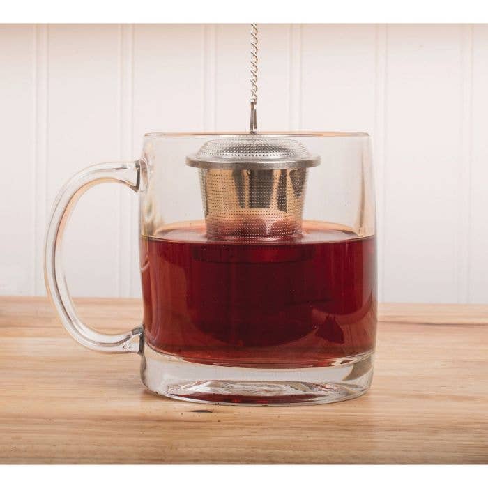 HIC Kitchen Barrel Tea Infuser, Large, in use within a glass mug, showcasing its easy tea steeping capability with loose leaves, perfect for kitchen enthusiasts.