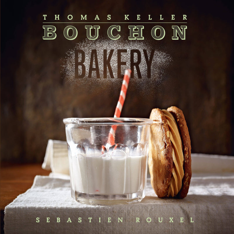 Cover of Thomas Keller Bouchon Bakery cookbook featuring a milk glass with a striped straw and a sandwich cookie, highlighting innovative American and French baked goods.