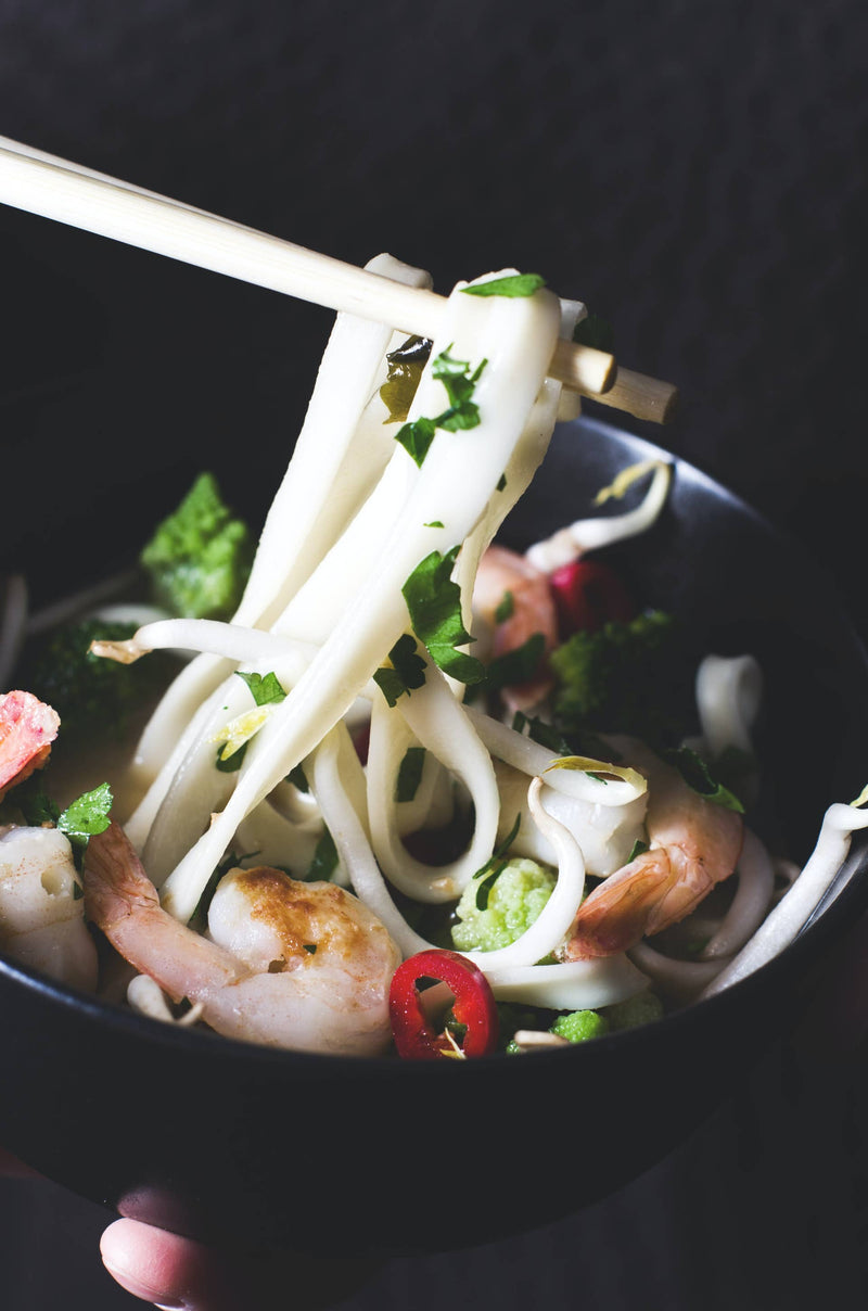 Mikuni Wild Harvest USA - Tsuki Matsutake Mushroom Shoyu Ramen Base displayed with noodles, shrimp, and vegetables, highlighting its authentic culinary appeal for creative home chefs.